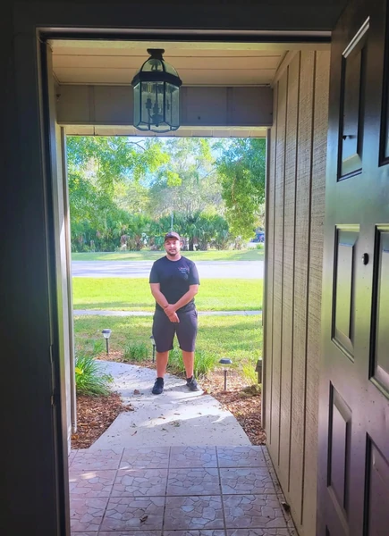 Technician arriving at a customer's front door