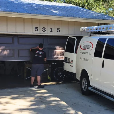 Southern Garage Doors technician on site, beginning a 17-point inspection at a Sarasota-area home