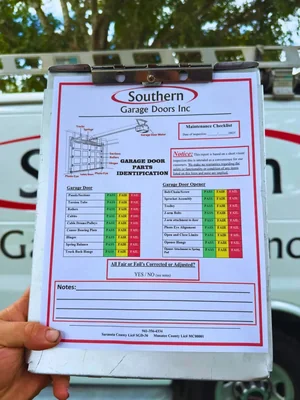 Southern Garage Doors maintenance checklist on a branded clipboard, used on every inspection