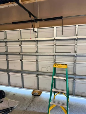Interior view of a properly installed sectional garage door with torsion spring in place